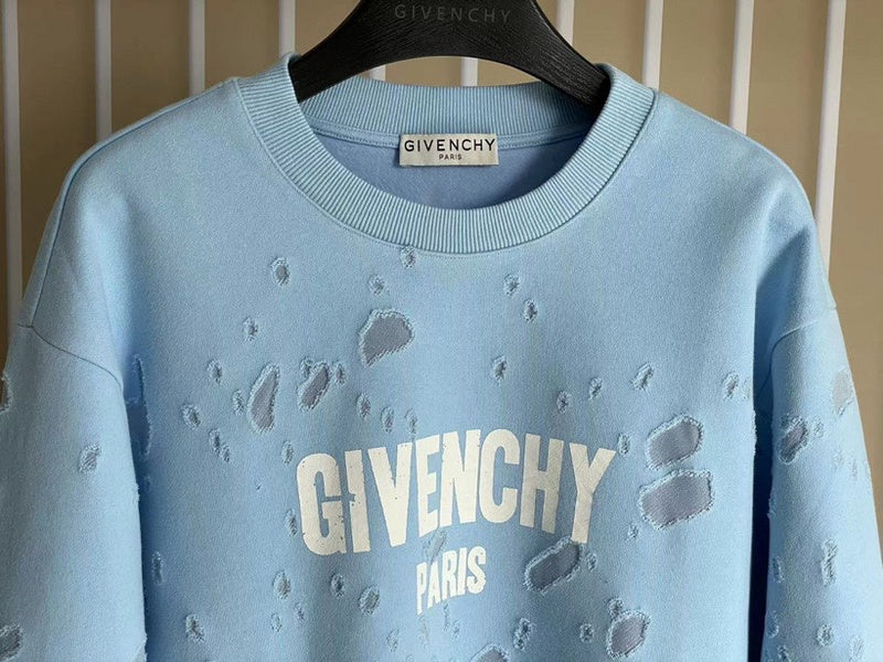 Close-up detail shot of Givenchy luxury clothing with logo-detail design