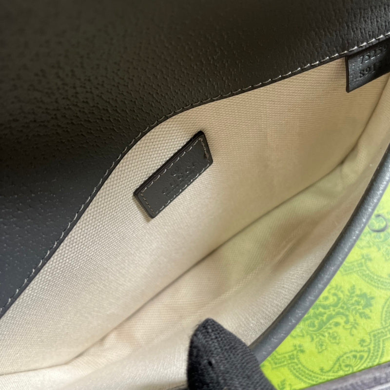 Handle and strap detail of elevated polished women's handbag – women's designer-style accessory