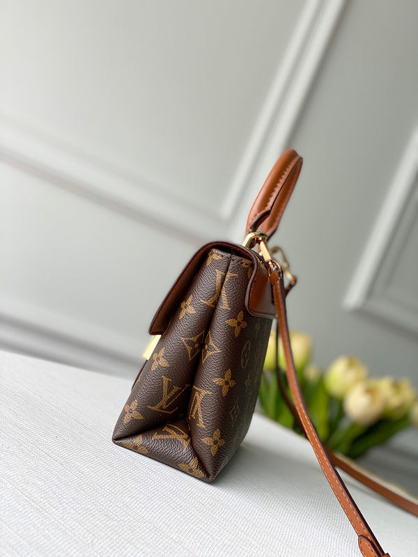 Styled lifestyle shot of elevated premium women's handbag – women's luxury handbag