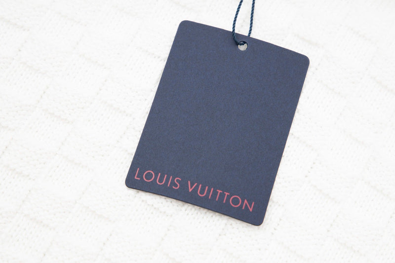 Flat lay presentation of Louis Vuitton luxury clothing with everyday silhouette