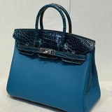 Side view of curated structured handbag