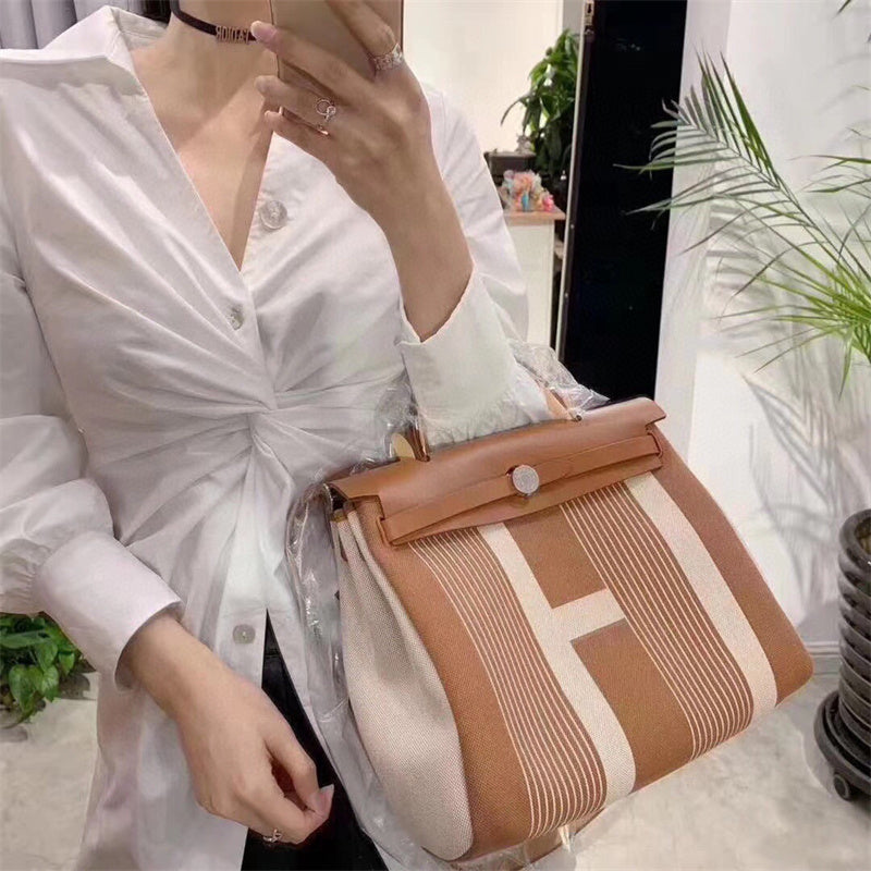 Side view of minimalist structured handbag