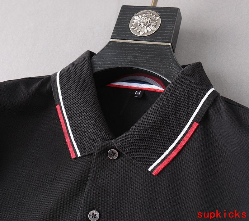 Close-up detail shot of Moncler luxury clothing with monogram-inspired silhouette