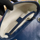 Side profile of statement polished women's handbag – women's statement bag