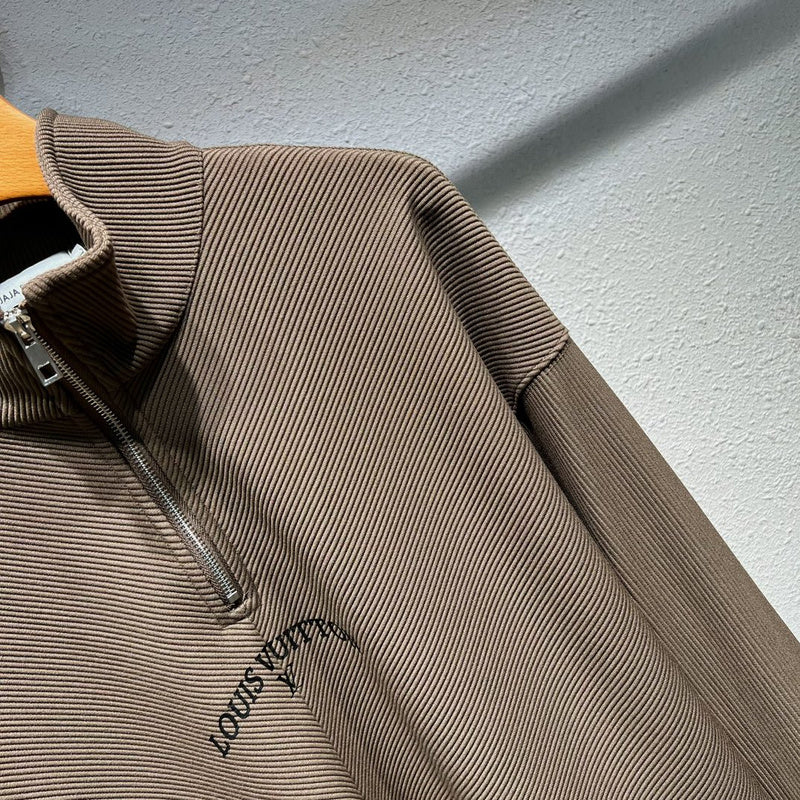 Flat lay presentation of Louis Vuitton luxury clothing with monogram-inspired silhouette