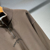 Flat lay presentation of Louis Vuitton luxury clothing with monogram-inspired silhouette