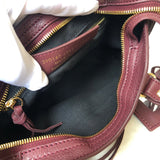 Handle and strap detail of everyday-luxe sleek women's handbag – women's statement bag