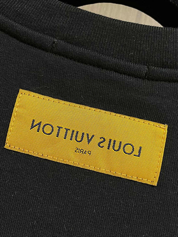 Close-up detail shot of Louis Vuitton luxury clothing with relaxed-fit cut