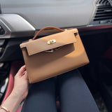 Side view of streamlined structured handbag
