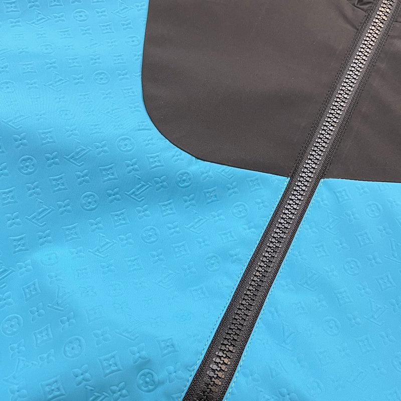 Flat lay presentation of Louis Vuitton luxury clothing with monogram-inspired silhouette