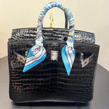 Side view of classic structured handbag