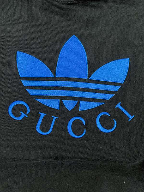 Full styled look of Gucci luxury clothing with monogram-inspired silhouette