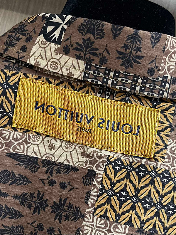 Front view of Louis Vuitton luxury clothing with logo-detail design