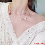 Lifestyle view of Van Cleef & Arpels unisex jewelry piece
