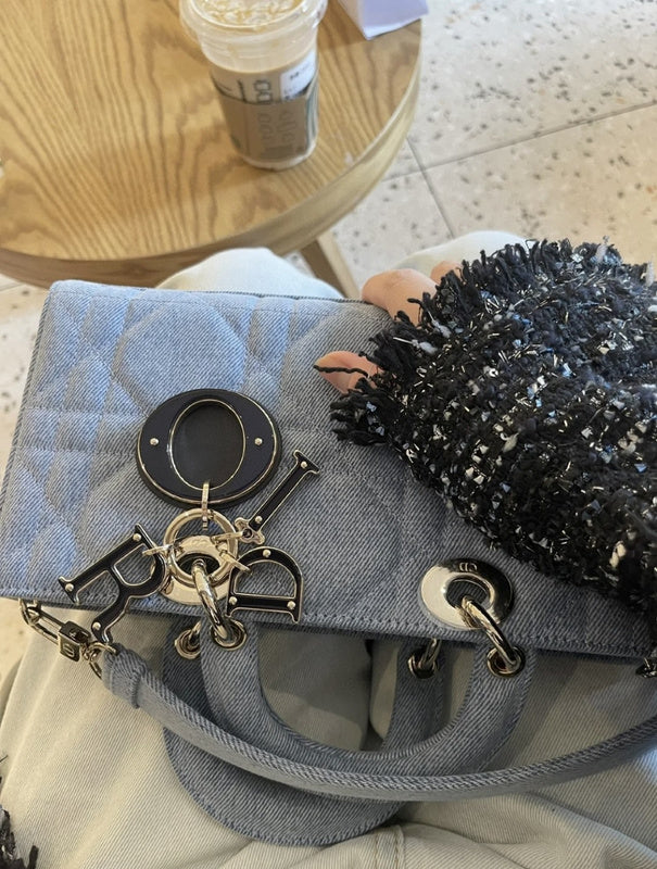 Styled lifestyle shot of refined elevated women's handbag – women's designer-style accessory
