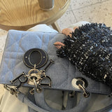 Styled lifestyle shot of refined elevated women's handbag – women's designer-style accessory