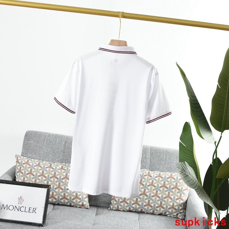 Flat lay presentation of Moncler luxury clothing with logo-detail design