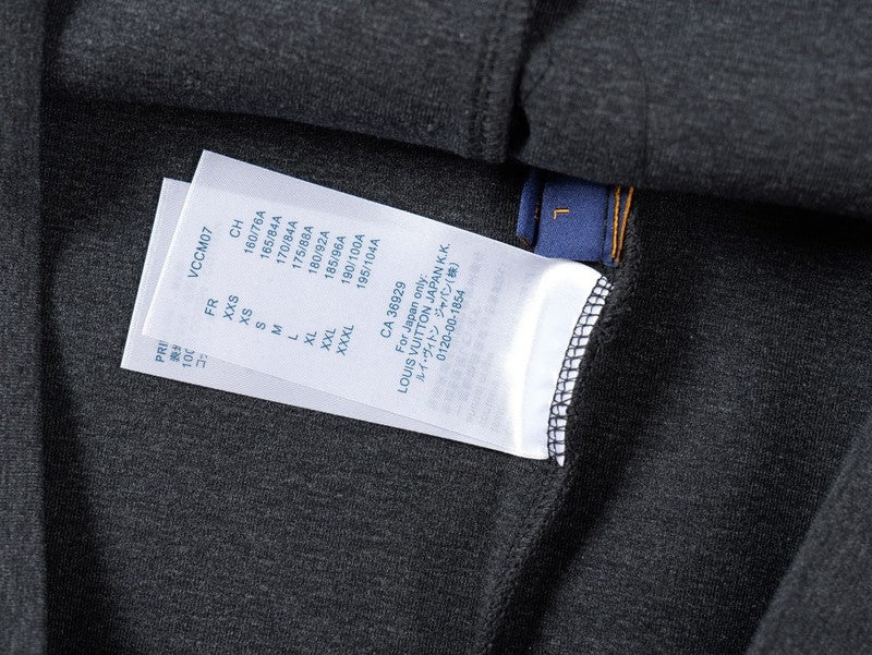 Close-up detail shot of Louis Vuitton luxury clothing with runway-inspired design