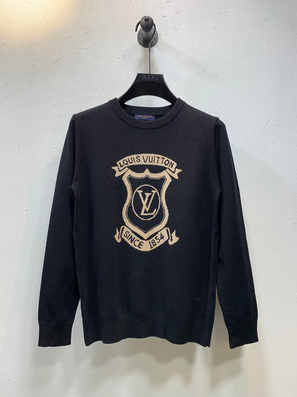 Back view of Louis Vuitton luxury clothing with label-forward styling