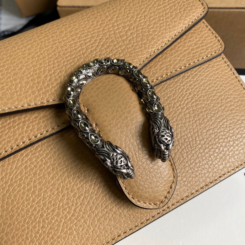Handle and strap detail of sleek polished women's handbag – women's statement bag
