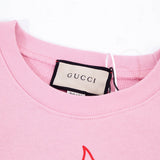 Close-up detail shot of Gucci luxury clothing with streetwear-inspired cut