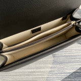 Side profile of statement signature women's handbag – women's statement bag