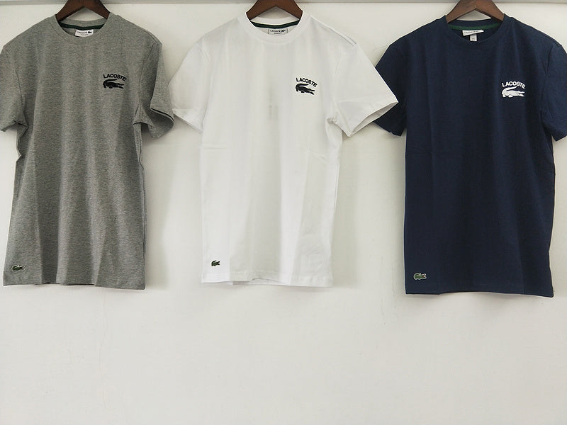 Close-up detail shot of Lacoste luxury clothing with signature branding