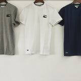 Close-up detail shot of Lacoste luxury clothing with signature branding