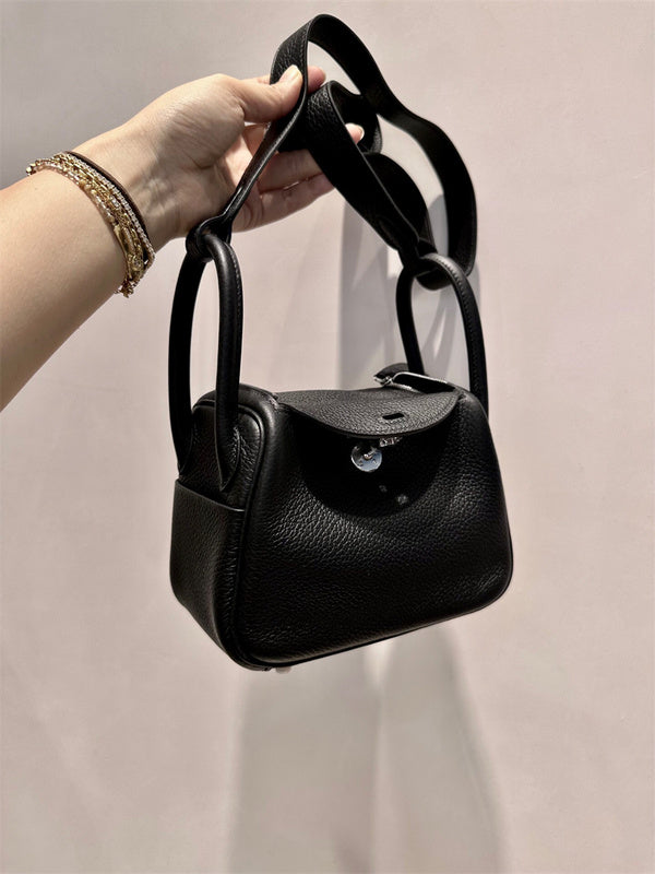 Side view of modern structured handbag