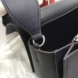 Top view of statement refined women's handbag – women's luxury accessory