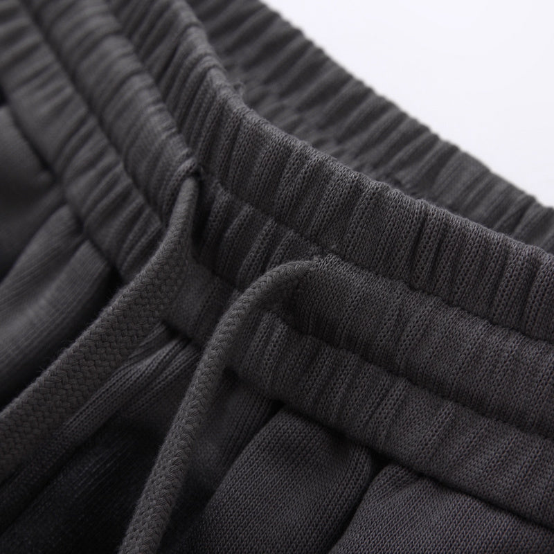 Flat lay presentation of Gucci luxury clothing with monogram-inspired silhouette