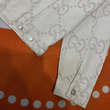 Side profile of Gucci luxury clothing with logo-detail design