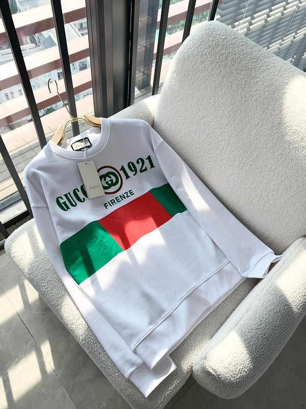 Flat lay presentation of Gucci luxury clothing with monogram-inspired silhouette