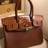  Sleek top-handle bag carried on shoulder