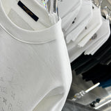 Flat lay presentation of Louis Vuitton luxury clothing with contemporary cut
