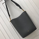 Front view of elevated signature women's handbag – women's statement bag