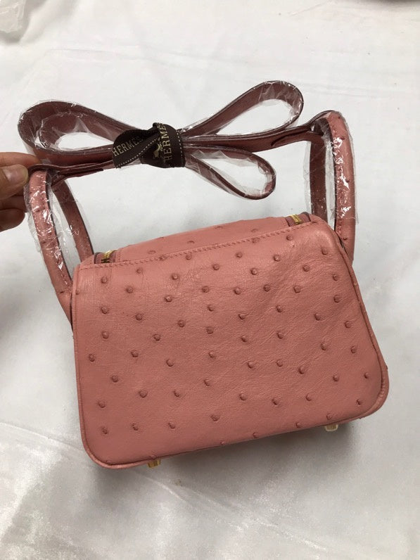 Side view of curated structured handbag