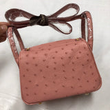 Side view of curated structured handbag