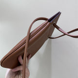 Side view of classic structured handbag