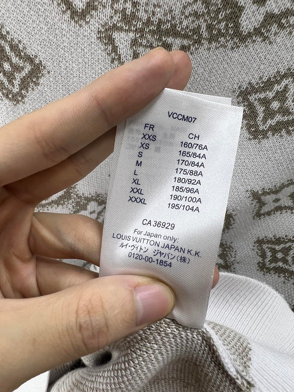 Side profile of Louis Vuitton luxury clothing with logo-detail design