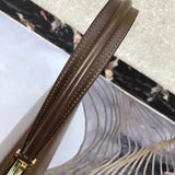 Handle and strap detail of everyday-luxe statement women's handbag – women's luxury handbag