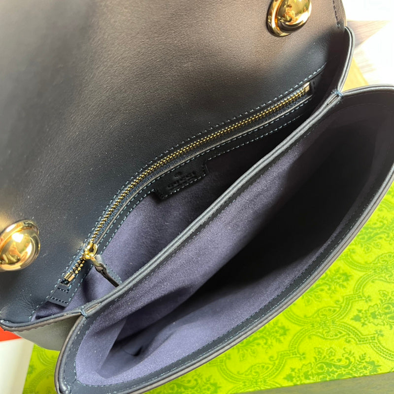 Side profile of signature polished women's handbag – women's luxury handbag