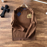 Close-up detail shot of Louis Vuitton luxury clothing with logo-detail design
