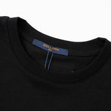 Close-up detail shot of Louis Vuitton cotton t-shirt with logo-detail design