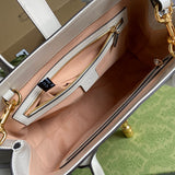 Side profile of structured statement women's handbag – women's statement bag