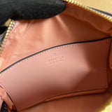 Side view of sculpted structured handbag