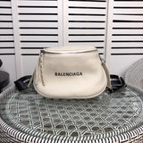 Side profile of everyday-luxe signature women's handbag – women's luxury accessory