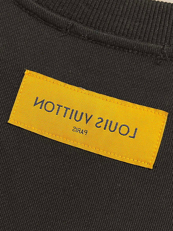 Side profile of Louis Vuitton luxury clothing with tailored silhouette