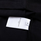 Side profile of Givenchy luxury clothing with monogram-inspired silhouette