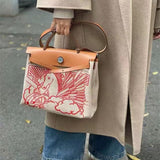 Side view of sophisticated structured handbag